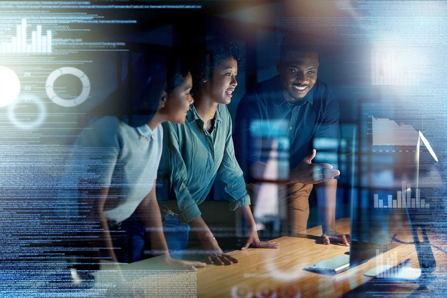 Team reviewing digital data visualizations, representing CorVel’s technology-driven approach to modern workers’ compensation through early action and smart analytics.