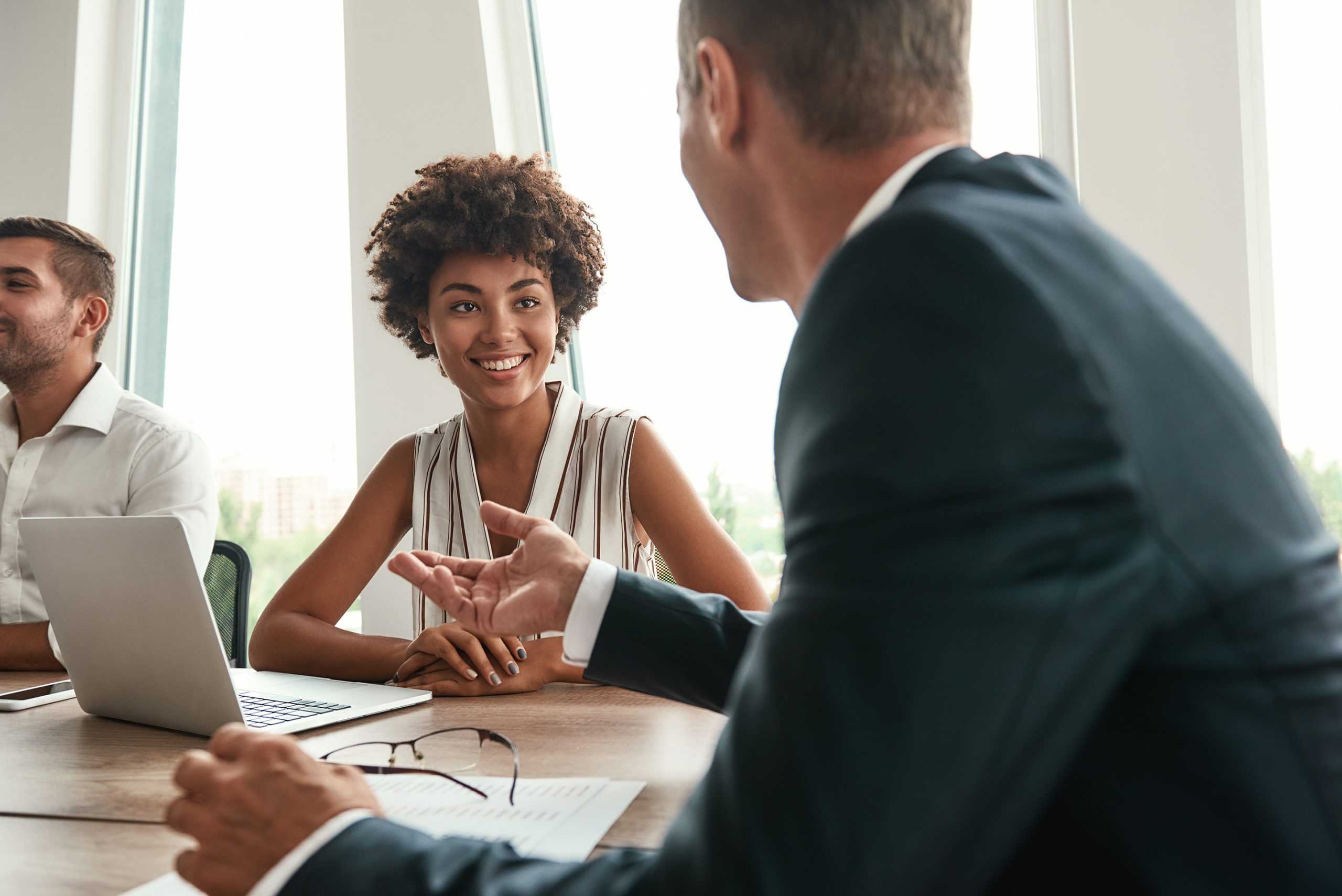 a young female professional in a meeting with a male workers comp legal nurse consultant